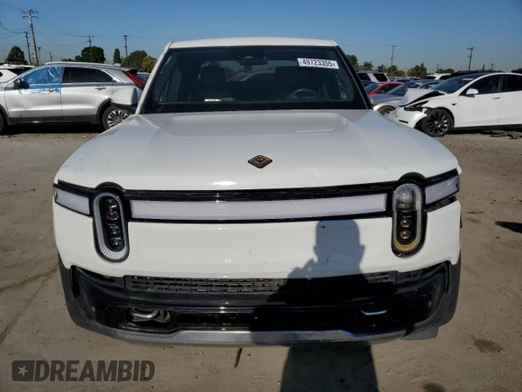 2022 Rivian R1T Adventure z VIN 7FCTGAAA9NN014280, wystawiony jako Copart lot #49723355 z przebiegiem 28 601 mil mil oraz Szkody całkowita. Historia ofert i sprzedaży dostępna na DreamBid. Obrazek 5.