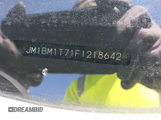 2015 Mazda 3 i SV with VIN JM1BM1T71F1218642, listed as a IAAI auction lot 42142795 with 134,143 mi miles. Bid and sale history available at carsss.com. Image 9.