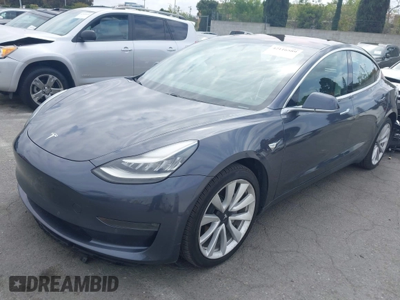 2018 Tesla Model 3 Long Range Battery with VIN 5YJ3E1EA8JF059385, listed as a IAAI auction lot 42116589 with 63,630 mi miles and . Bid and sale history available at DreamBid. Image 2.