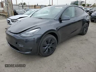 2025 Tesla Model Y Long Range with VIN 7SAYGDED4SF242721, listed as a Copart auction lot 56159955 with 7,131 mi miles and Salvage Title. Bid and sale history available at DreamBid. Image 1.
