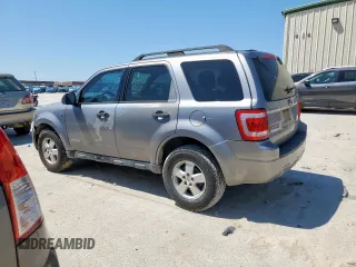 2008 Ford Escape XLT with VIN 1FMCU03198KD65116, listed as a Copart auction lot 52130965 with 214,295 mi miles and Salvage title. Bid and sale history available at DreamBid. Image 2.