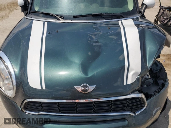 2013 MINI Countryman S with VIN WMWZC3C58DWP21965, listed as a Copart auction lot 61161735 with 142,797 mi miles and Salvage title. Bid and sale history available at DreamBid. Image 12.