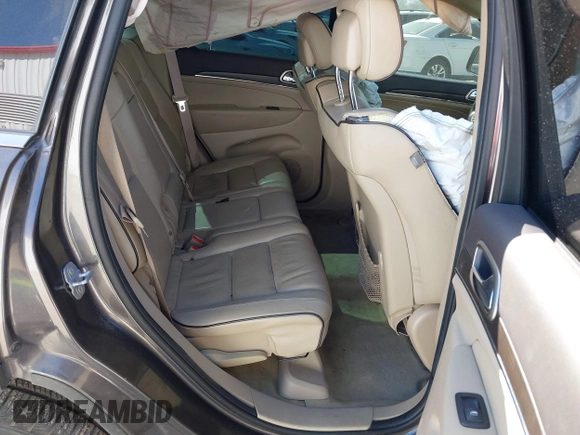 2015 Jeep Grand Cherokee Overland with VIN 1C4RJECT2FC648292, listed as a IAAI auction lot 41806402 with 116,766 mi miles. Bid and sale history available at carsss.com. Image 8.