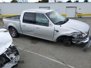 2002 Ford F-150 XLT with VIN 1FTRW07602KE38959, listed as a Copart auction lot 50547095 with 160,908 mi miles and Salvage Title. Bid and sale history available at carsss.com. Image 4.