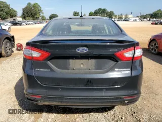 2016 Ford Fusion Titanium z VIN 3FA6P0K98GR151640, wystawiony jako Copart lot #73254594 z przebiegiem 145 473 mil mil oraz Szkoda całkowita • Salvage title. Historia ofert i sprzedaży dostępna na DreamBid. Obrazek 6.