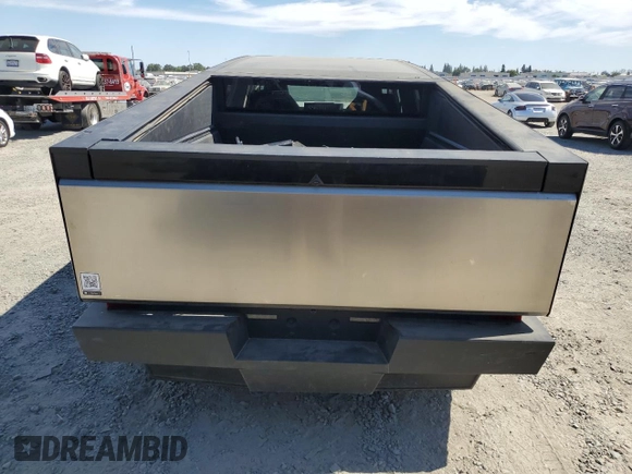 2024 Tesla Cybertruck с VIN 7G2CEHEDXRA010522, выставлен на аукционе Copart как лот 60874185 с пробегом Не указан миль и Списание • Salvage title. История ставок и продаж доступна на DreamBid. Изображение 6.