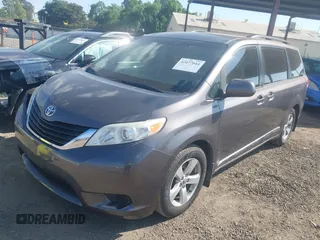 2014 Toyota Sienna LE AAS with VIN 5TDKK3DC0ES498732, listed as a IAAI auction lot 42077044 with 189,745 mi miles and . Bid and sale history available at carsss.com. Image 2.
