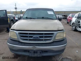 2001 Ford F-150 SuperCrew XLT with VIN 1FTRW07W61KE35305, listed as a IAAI auction lot 41912087 with 221,826 mi miles. Bid and sale history available at carsss.com. Image 6.