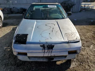 1989 Toyota MR2 z VIN JT2AW15C0K0146356, wystawiony jako Copart lot #76256644 z przebiegiem 294 380 mil mil oraz Tytuł czysty. Historia ofert i sprzedaży dostępna na DreamBid. Obrazek 5.
