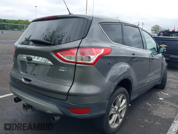 2013 Ford Escape SEL z VIN 1FMCU9H96DUC66206, wystawiony jako IAAI lot #42376442 z przebiegiem 96 776 mil mil oraz . Historia ofert i sprzedaży dostępna na DreamBid. Obrazek 4.
