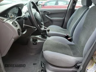 2004 Ford Focus LX with VIN 1FAFP33P24W148563, listed as a Copart auction lot 63869755 with 142,243 mi miles and Salvage title. Bid and sale history available at DreamBid. Image 7.