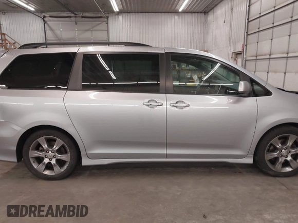 2015 Toyota Sienna SE with VIN 5TDXK3DC9FS527667, listed as a IAAI auction lot 41977729 with 230,933 mi miles and . Bid and sale history available at DreamBid. Image 14.