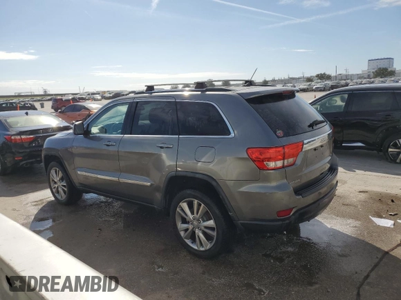 2012 Jeep Grand Cherokee Laredo with VIN 1C4RJEAG1CC306950, listed as a Copart auction lot 84912434 with 128,659 mi miles and Salvage Title. Bid and sale history available at carsss.com. Image 2.