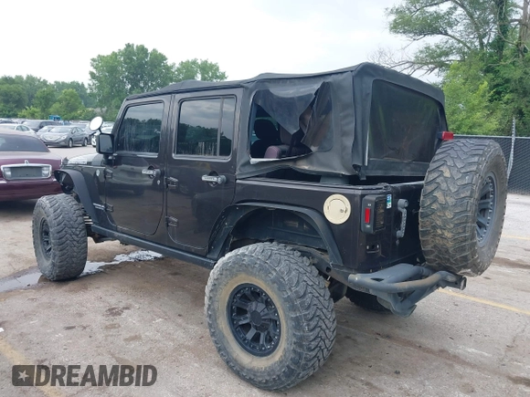 2013 Jeep Wrangler Unlimited Rubicon with VIN 1C4BJWFG5DL652050, listed as a IAAI auction lot 42451954 with 107,110 mi miles and . Bid and sale history available at DreamBid. Image 3.