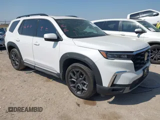 2023 Honda Pilot Touring z VIN 5FNYG2H77PB013738, wystawiony jako IAAI lot #42013874 z przebiegiem 33 677 mil mil oraz . Historia ofert i sprzedaży dostępna na DreamBid. Obrazek 1.
