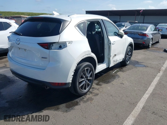 2017 Mazda CX-5 Grand Touring with VIN JM3KFADLXH0222341, listed as a IAAI auction lot 41990464 with 94,374 mi miles and . Bid and sale history available at carsss.com. Image 4.