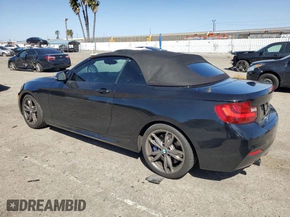 2015 BMW 2 Series M235i with VIN WBA1M1C56FV393730, listed as a Copart auction lot 45348734 with 59,231 mi miles and Salvage title. Bid and sale history available at DreamBid. Image 2.