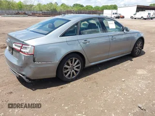 2013 Audi A6 Prestige z VIN WAUHGAFC5DN005495, wystawiony jako IAAI lot #42103621 z przebiegiem 62 268 mil mil oraz . Historia ofert i sprzedaży dostępna na DreamBid. Obrazek 4.