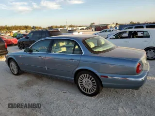 2005 Jaguar XJ VDP with VIN SAJWA82C65SG45247, listed as a Copart auction lot 77950594 with 0 mi miles and Salvage Title. Bid and sale history available at carsss.com. Image 2.