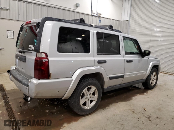 2006 Jeep Commander with VIN 1J8HG48N86C275203, listed as a Copart auction lot 57827085 with 197,552 mi miles and Clean title. Bid and sale history available at DreamBid. Image 3.