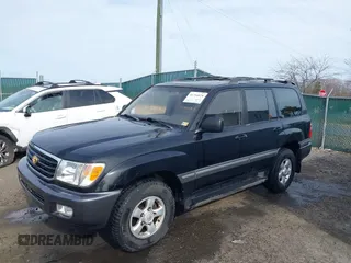 1998 Toyota Land Cruiser with VIN JT3HT05J2W0017214, listed as a IAAI auction lot 41716028 with 214,047 mi miles. Bid and sale history available at carsss.com. Image 2.