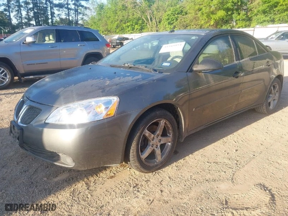 2006 Pontiac G6 GT with VIN 1G2ZH578164171631, listed as a IAAI auction lot 41945854 with 137,457 mi miles. Bid and sale history available at carsss.com. Image 2.