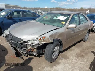 2003 Toyota Camry LE with VIN 4T1BE32KX3U123873, listed as a IAAI auction lot 42085492 with 166,901 mi miles and . Bid and sale history available at DreamBid. Image 2.