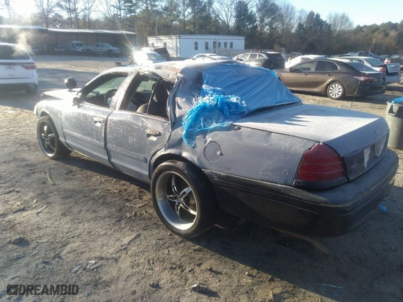 2005 Ford Police Interceptor with VIN 2FAFP71W25X138929, listed as a IAAI auction lot 41156277 with 186,991 mi miles. Bid and sale history available at carsss.com. Image 3.