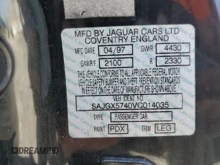 1997 Jaguar XK with VIN SAJGX5740VC014035, listed as a Copart auction lot 53066215 with 140,692 mi miles and Salvage Title. Bid and sale history available at DreamBid. Image 14.