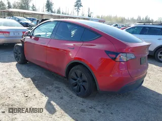 2024 Tesla Model Y Long Range with VIN 7SAYGDEE9RF199805, listed as a IAAI auction lot 42018221 with 7,359 mi miles. Bid and sale history available at carsss.com. Image 3.