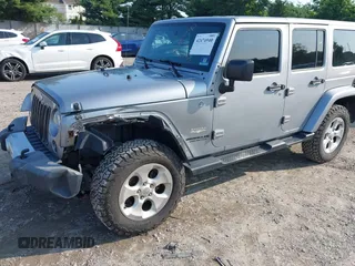 2015 Jeep Wrangler Unlimited Sahara with VIN 1C4BJWEG9FL570780, listed as a IAAI auction lot 42474940 with 116,226 mi miles and . Bid and sale history available at DreamBid. Image 6.
