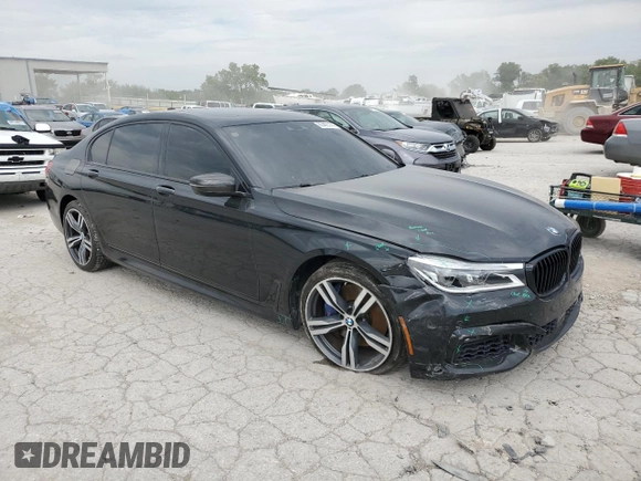 2018 BMW 7 Series 750i with VIN WBA7F0C58JGM23743, listed as a Copart auction lot 63465144 with 44,580 mi miles and Salvage Title. Bid and sale history available at carsss.com. Image 4.