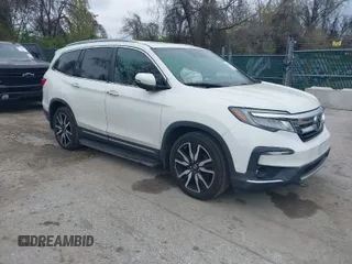 2019 Honda Pilot Touring 8-Passenger with VIN 5FNYF5H93KB001858, listed as a IAAI auction lot 42001069 with 73,092 mi miles. Bid and sale history available at carsss.com. Image 1.