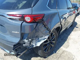 2021 Mazda CX-9 Carbon Edition with VIN JM3TCADY9M0517174, listed as a IAAI auction lot 41871485 with 48,484 mi miles and . Bid and sale history available at DreamBid. Image 6.