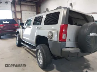2006 Hummer H3 with VIN 5GTDN136268123052, listed as a IAAI auction lot 42126283 with 124,040 mi miles. Bid and sale history available at carsss.com. Image 3.