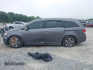 2014 Honda Odyssey Touring with VIN 5FNRL5H98EB008953, listed as a IAAI auction lot 42291179 with Not provided miles and . Bid and sale history available at DreamBid. Image 13.