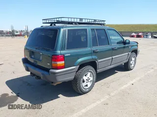 1995 Jeep Grand Cherokee Laredo with VIN 1J4GZ58Y2SC669152, listed as a IAAI auction lot 42077067 with 134,022 mi miles. Bid and sale history available at carsss.com. Image 4.