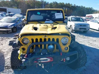 2015 Jeep Wrangler Unlimited Rubicon z VIN 1C4BJWFG4FL681946, wystawiony jako IAAI lot #40809597 z przebiegiem 57 148 mil mil oraz . Historia ofert i sprzedaży dostępna na DreamBid. Obrazek 12.