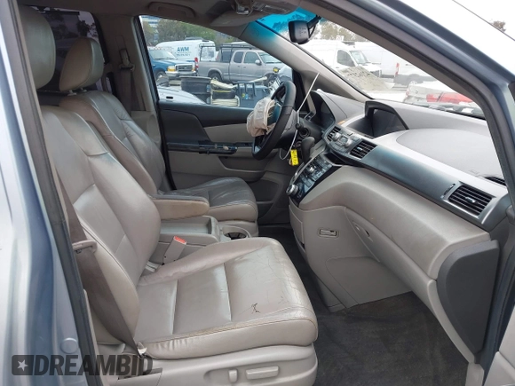 2012 Honda Odyssey EX-L with VIN 5FNRL5H66CB061847, listed as a IAAI auction lot 42162377 with 217,204 mi miles and . Bid and sale history available at DreamBid. Image 5.
