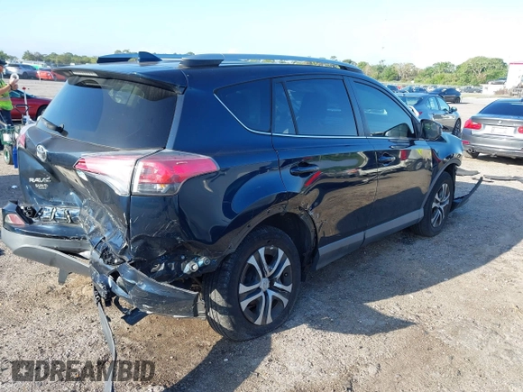 2018 Toyota RAV4 LE with VIN JTMZFREV1JJ203943, listed as a IAAI auction lot 41921863 with 104,691 mi miles. Bid and sale history available at carsss.com. Image 4.