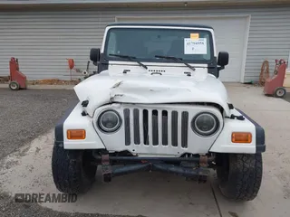 2005 Jeep Wrangler Sport with VIN 1J4FA49S25P352170, listed as a IAAI auction lot 41794958 with 154,304 mi miles. Bid and sale history available at carsss.com. Image 13.