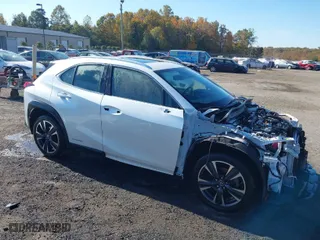 2021 Lexus UX with VIN JTHP9JBH5M2053797, listed as a IAAI auction lot 40718103 with 57,366 mi miles. Bid and sale history available at carsss.com. Image 1.