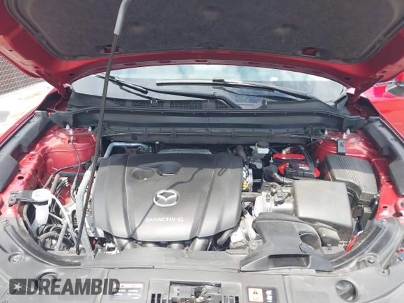 2021 Mazda CX-5 Grand Touring with VIN JM3KFADM6M1373111, listed as a IAAI auction lot 42784431 with 14,374 mi miles and . Bid and sale history available at DreamBid. Image 10.