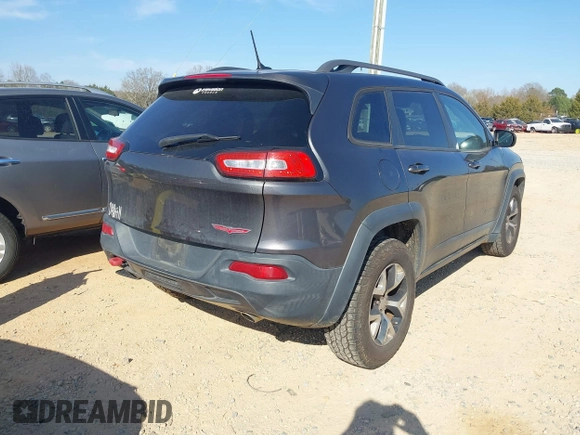 2014 Jeep Cherokee Trailhawk with VIN 1C4PJMBS6EW278987, listed as a IAAI auction lot 41789868 with 136,696 mi miles. Bid and sale history available at carsss.com. Image 4.
