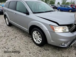 2017 Dodge Journey SXT with VIN 3C4PDCBB0HT545567, listed as a Copart auction lot 57766105 with 56,569 mi miles and Salvage title. Bid and sale history available at DreamBid. Image 14.