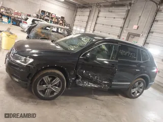 2020 Volkswagen Tiguan SE with VIN 3VV2B7AX4LM115131, listed as a IAAI auction lot 42017352 with 87,909 mi miles. Bid and sale history available at carsss.com. Image 14.