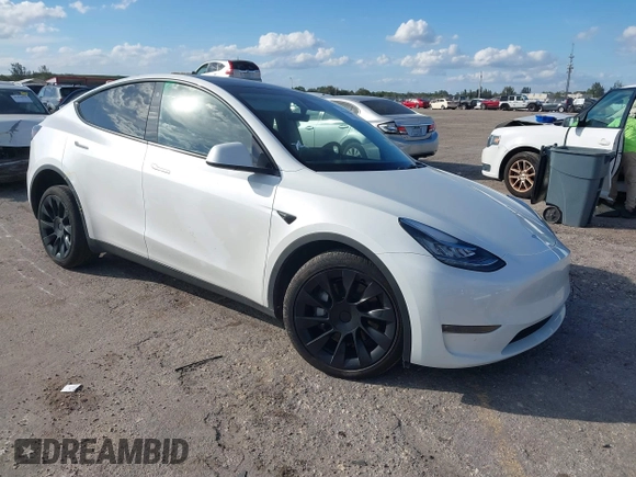 2023 Tesla Model Y Long Range z VIN 7SAYGDEE0PA128888, wystawiony jako IAAI lot #41410085 z przebiegiem 12 578 mil mil oraz . Historia ofert i sprzedaży dostępna na DreamBid. Obrazek 1.