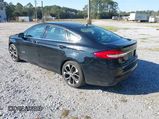 2018 Ford Fusion SE with VIN 3FA6P0LU7JR138906, listed as a IAAI auction lot 41573985 with 127,660 mi miles and . Bid and sale history available at DreamBid. Image 3.