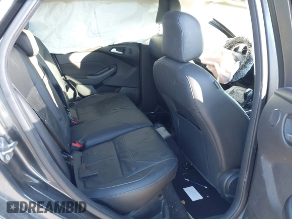 2015 Ford Focus Titanium z VIN 1FADP3N23FL368324, wystawiony jako IAAI lot #41387070 z przebiegiem Nie podano mil oraz . Historia ofert i sprzedaży dostępna na DreamBid. Obrazek 8.