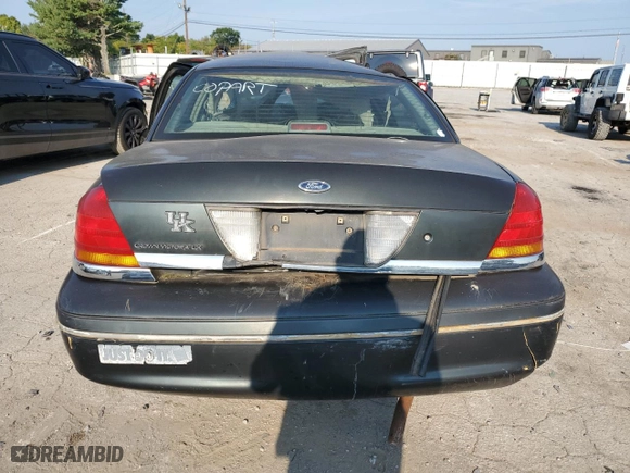 1999 Ford Crown Victoria LX with VIN 2FAFP74WXXX235990, listed as a Copart auction lot 69134854 with 174,636 mi miles and Non Repairable. Bid and sale history available at carsss.com. Image 6.